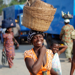 Ghana local woman carrying basket