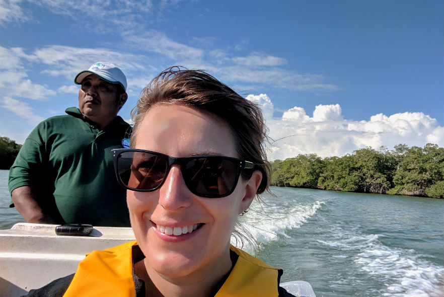 Volunteers in a boat on a lake in Belize 