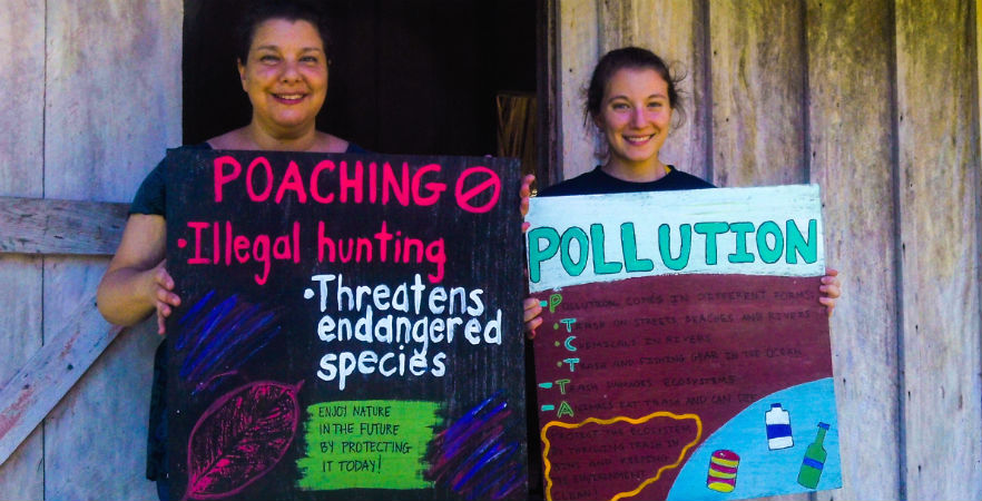 Volunteer making educational signs