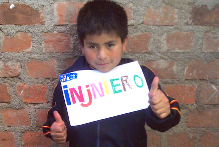 Boy holding piece of writing up