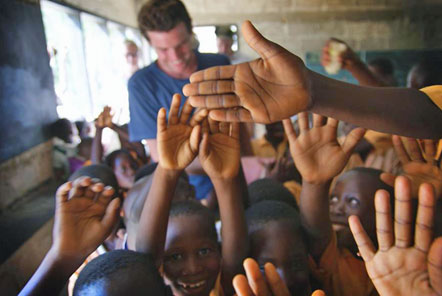 Volunteer in a classroom with children 