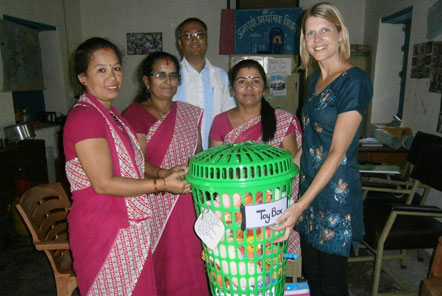 Volunteer donating toys