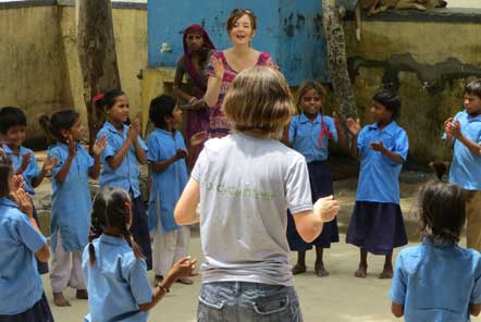 Volunteers playing outdoor games at a local school