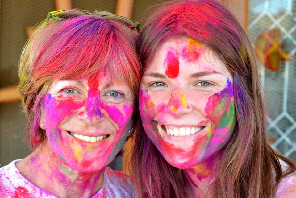 Ladies with paint on face and in hair