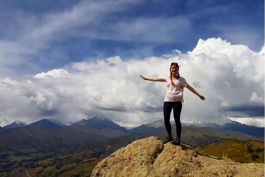 Volunteer on top of a mountain