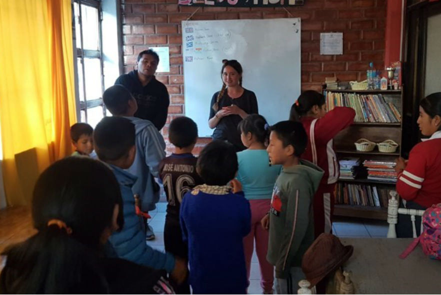 Volunteers in classroom with children 