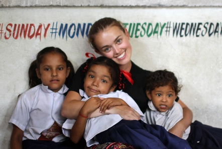 Volunteer with children in Nepal