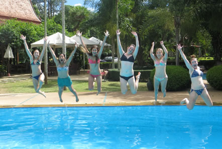 Volunteers jumping in the pool in Thailand