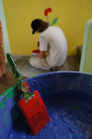 Volunteer painting in Nepal