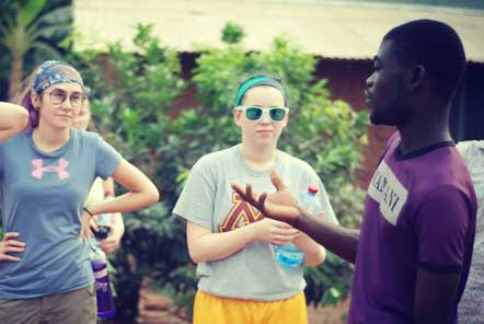 Two female volunteers being briefed on recycling projects 