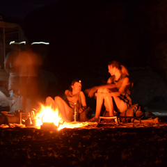 Volunteers at camp at night