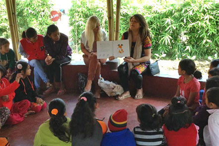 Yasmine and Jade teaching at the women's refuge