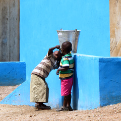 Ghana children by wall